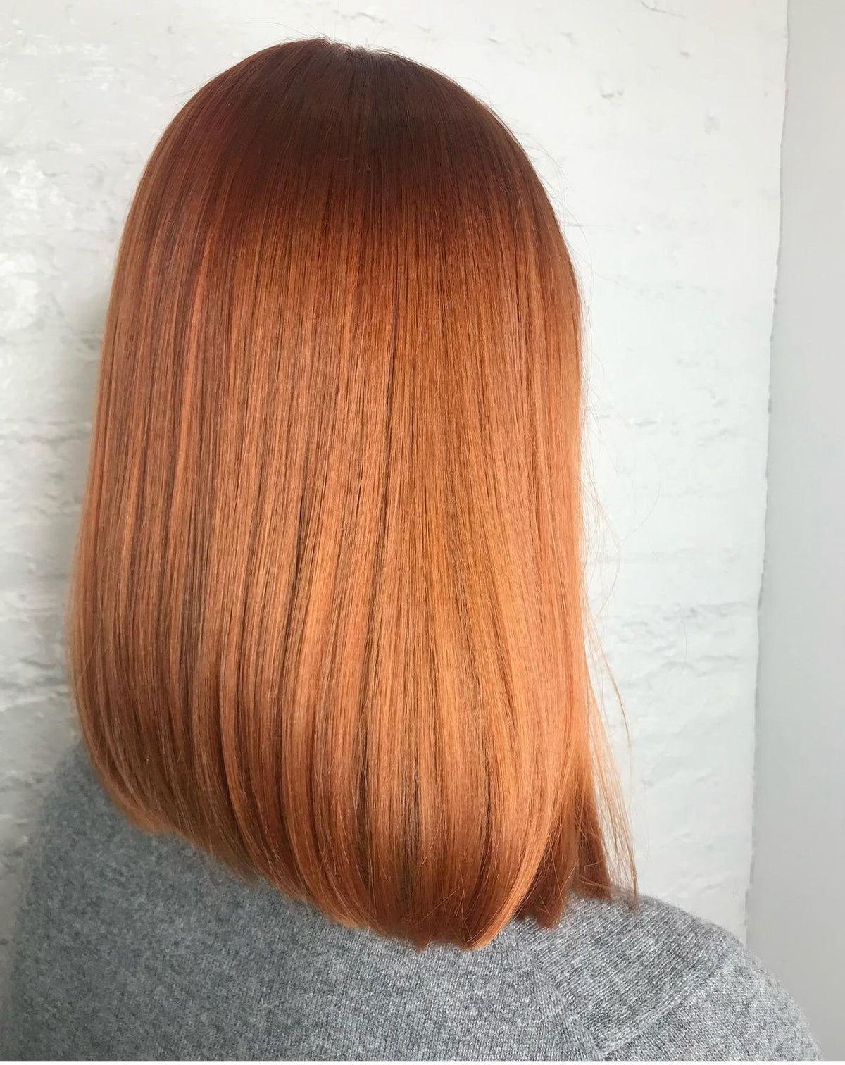 Copper red blunt lob haircut at Dubé New York, New York NY